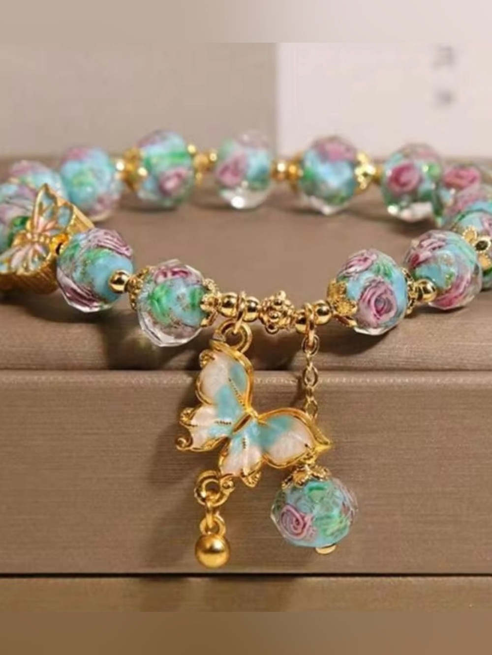 NWOT Gold Butterfly Charm Bracelet with Blue-Green Floral Beads